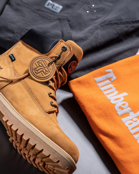 A close up of Timberland Pro boots, t-shirt and pants