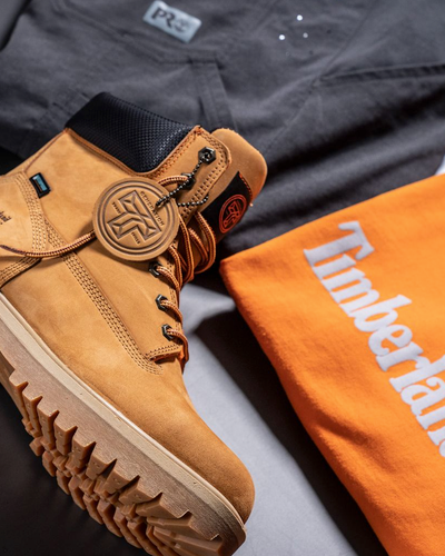 A close up of Timberland Pro boots, t-shirt and pants