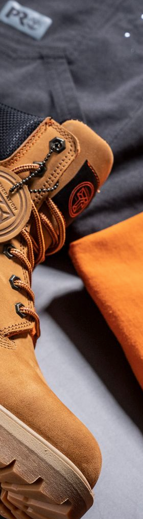 A close up of Timberland Pro boots, t-shirt and pants