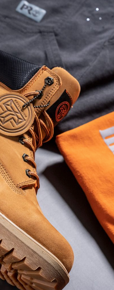 A close up of Timberland Pro boots, t-shirt and pants