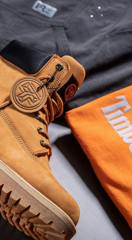 A close up of Timberland Pro boots, t-shirt and pants