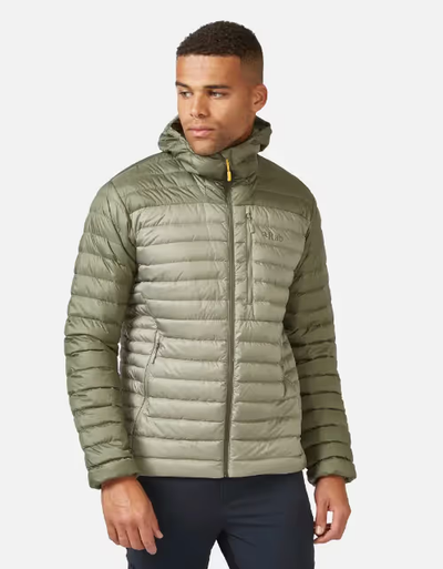 A man wearing an olive green puffy jacket by RAB