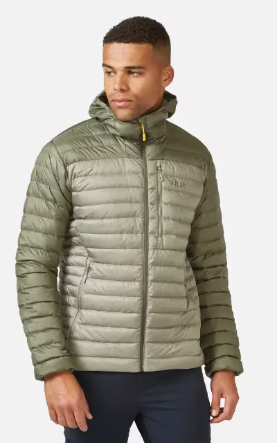 A man wearing an olive green puffy jacket by RAB