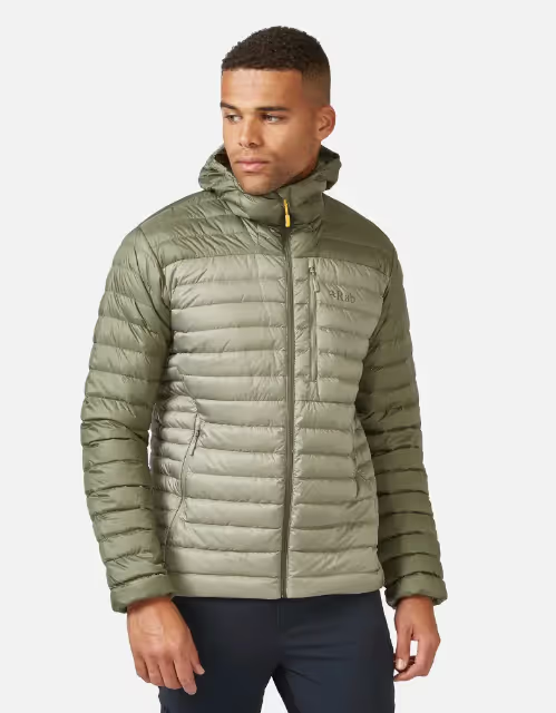 A man wearing an olive green puffy jacket by RAB