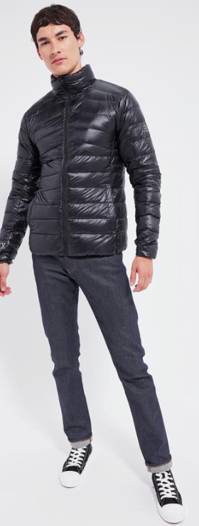A man wearing a slim Pyrenex Puff black jacket with slim-fit jeans