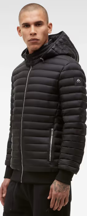 A man wearing a black Moose Knuckles puffy jacket