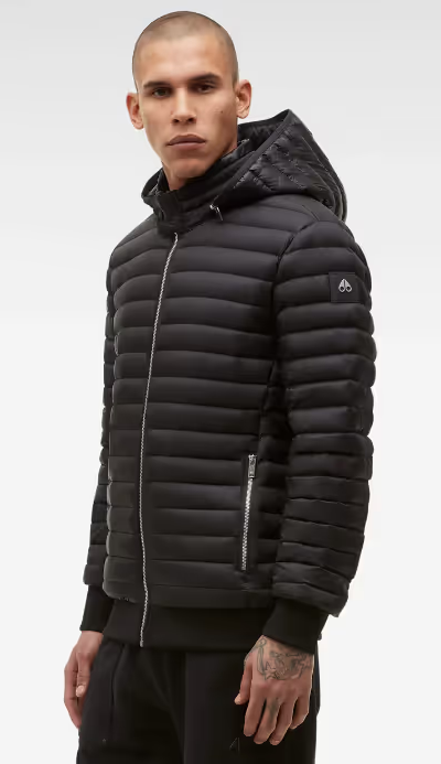 A man wearing a black Moose Knuckles puffy jacket