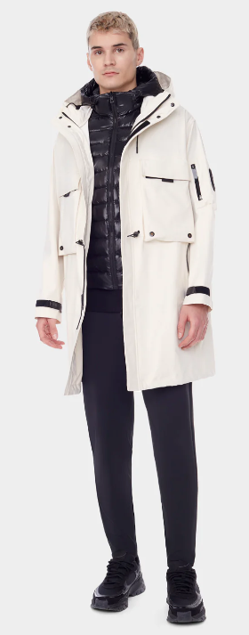 A man wearing a RudSak white winter jacket with a black puffy jacket underneath