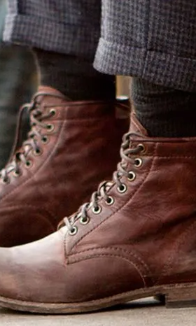 A man walking in a pair of brown Sorel boots
