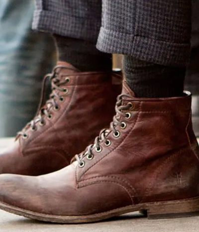 A man walking in a pair of brown Sorel boots