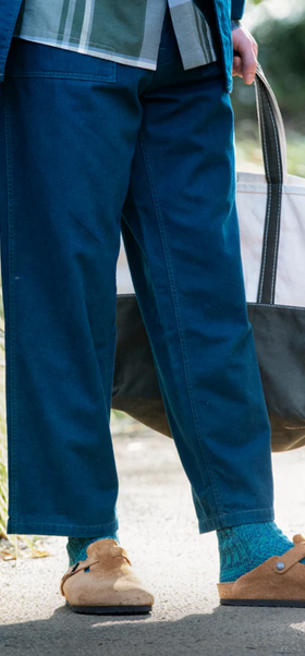 A man wearing a pair of Rototo blue socks