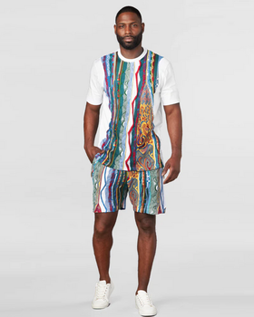 A man wearing a matching Coogi outfit with the classic design and matching shorts