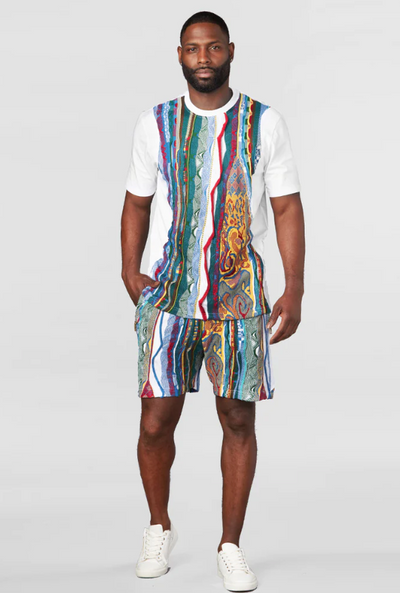 A man wearing a matching Coogi outfit with the classic design and matching shorts