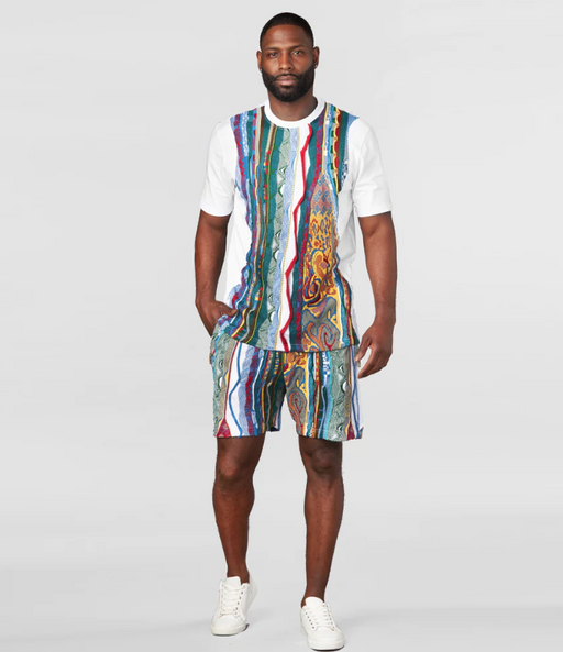 A man wearing a matching Coogi outfit with the classic design and matching shorts