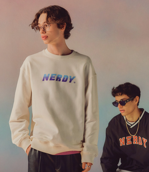 A man wearing a Nerdy branded crewneck in beige and blue