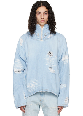 A man wearing a baby blue ripped denim jacket by the clothing brand 424