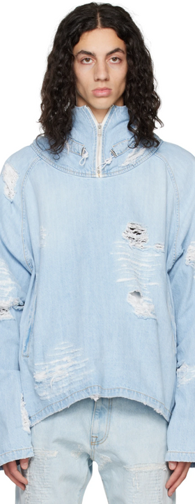 A man wearing a baby blue ripped denim jacket by the clothing brand 424
