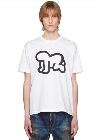 A man wearing a Junya Watanabe white graphic t-shirt and jeans