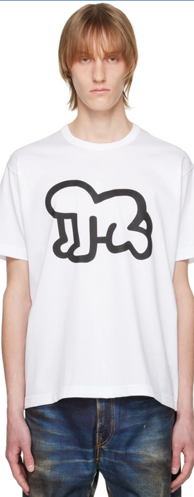 A man wearing a Junya Watanabe white graphic t-shirt and jeans