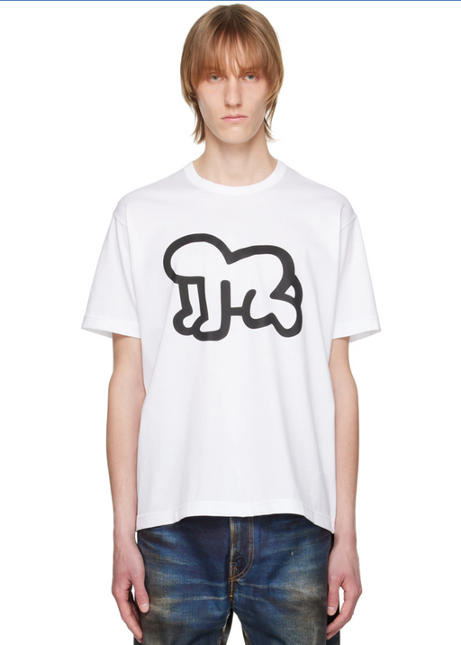A man wearing a Junya Watanabe white graphic t-shirt and jeans