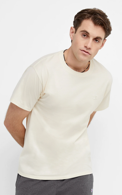 A man wearing a white Champion t-shirt