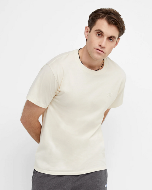 A man wearing a white Champion t-shirt