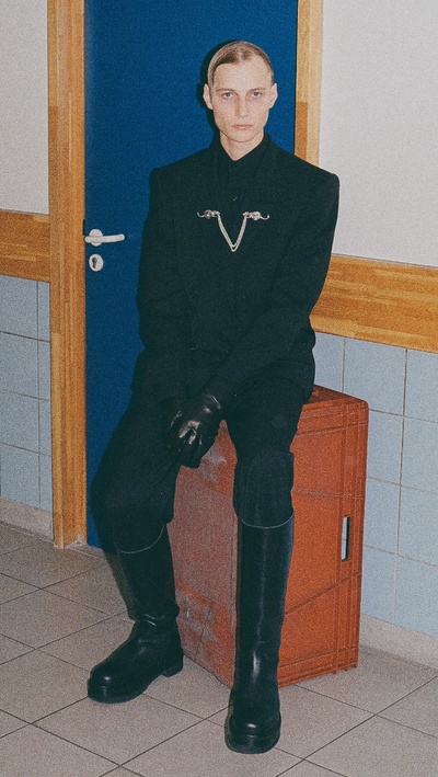A man wearing a Enfants Riches Déprimés black suit