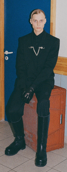 A man wearing a Enfants Riches Déprimés black suit