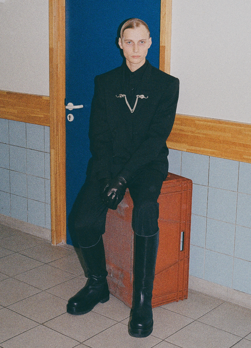 A man wearing a Enfants Riches Déprimés black suit