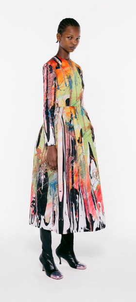 A womman wearing a colorful floral dress by Christopher Kane