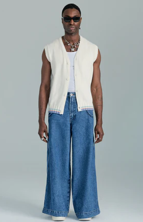 A man wearing JNCO vest with wide denim pants