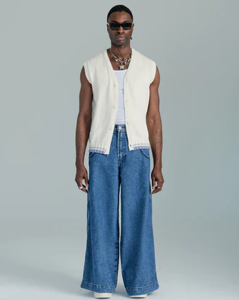 A man wearing JNCO vest with wide denim pants