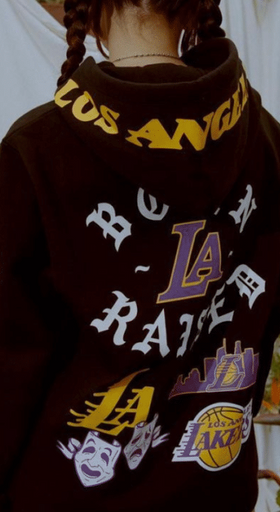 A man wearing a LA lakers Born x Raised hoodie
