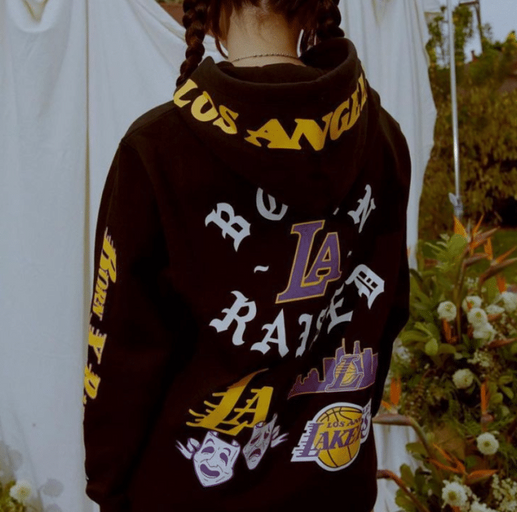 A man wearing a LA lakers Born x Raised hoodie