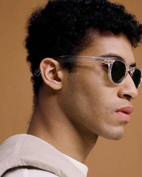 A man wearing a izipizi clear sunglasses