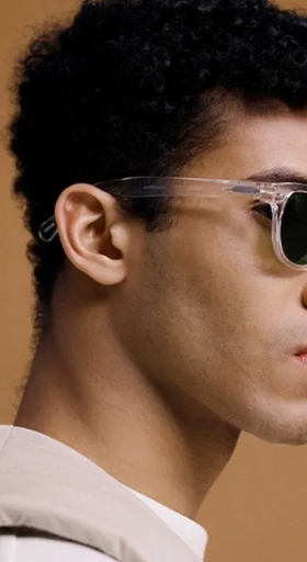 A man wearing a izipizi clear sunglasses