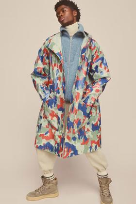 A man wearing colorful Isabel Marant jacket and cream pants