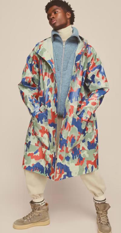 A man wearing colorful Isabel Marant jacket and cream pants