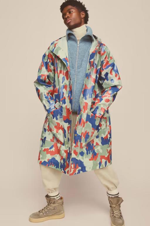 A man wearing colorful Isabel Marant jacket and cream pants