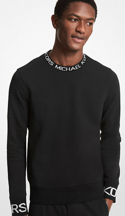 A man wearing a Michael Kors branded black long-sleeve