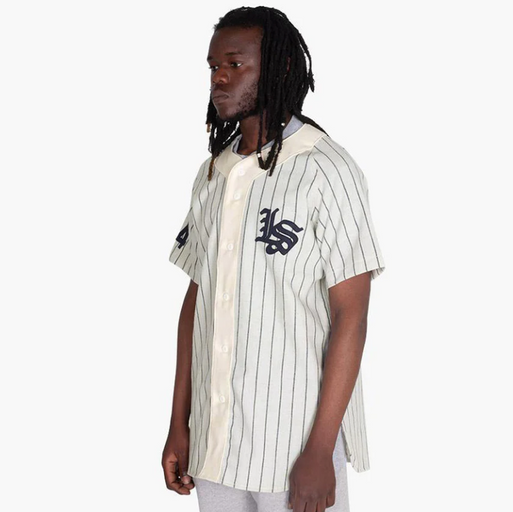 A man wearing a Livestock baseball jersey