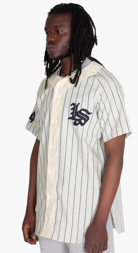 A man wearing a Livestock baseball jersey