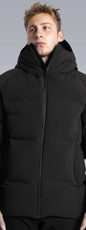A man wearing a black puffy Isaora jacket