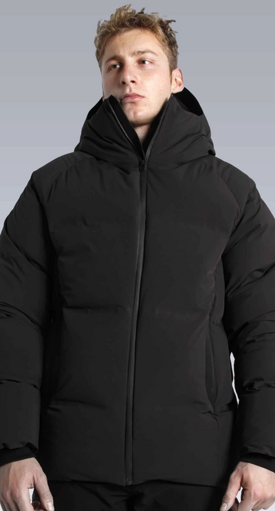 A man wearing a black puffy Isaora jacket