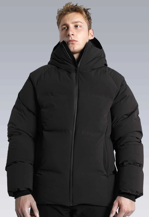 A man wearing a black puffy Isaora jacket