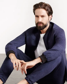 A man wearing a Superga casual suit with a white shirt underneath