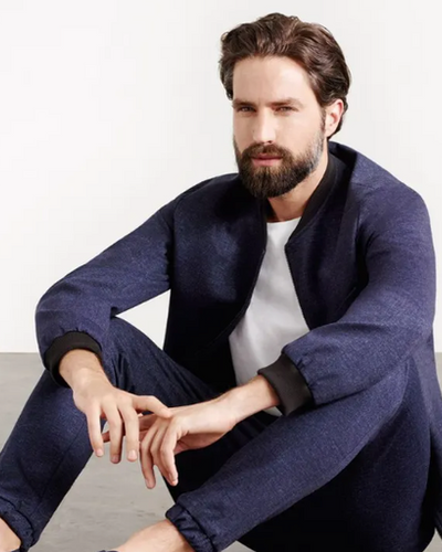 A man wearing a Superga casual suit with a white shirt underneath