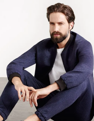 A man wearing a Superga casual suit with a white shirt underneath