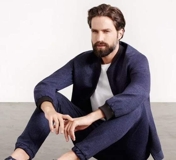 A man wearing a Superga casual suit with a white shirt underneath