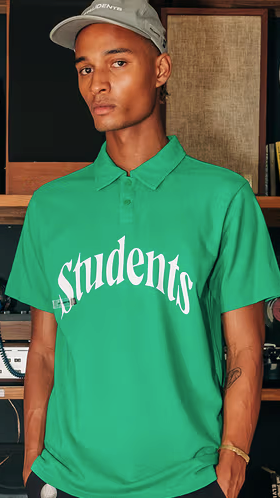 A man wearing a Students Golf green Golf shirt and grey hat